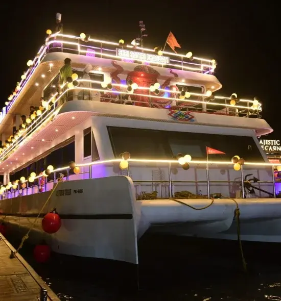 Guests enjoying a buffet dinner on a cruise deck at night
